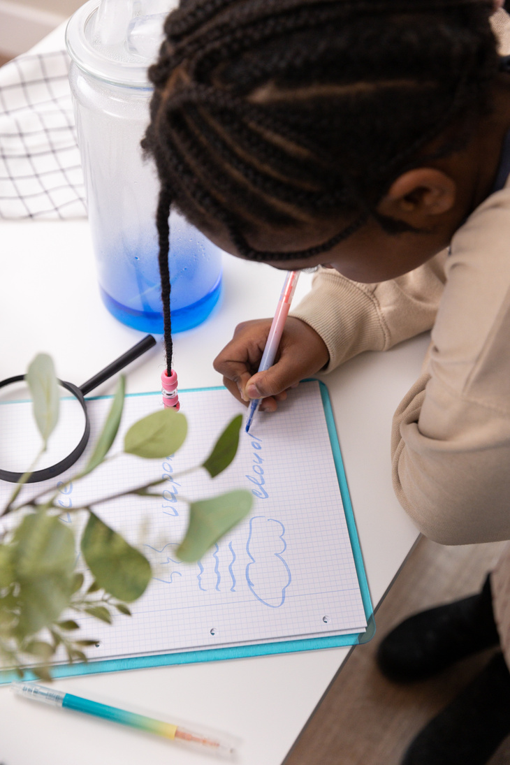 Kid Recording Science Experiment Observations