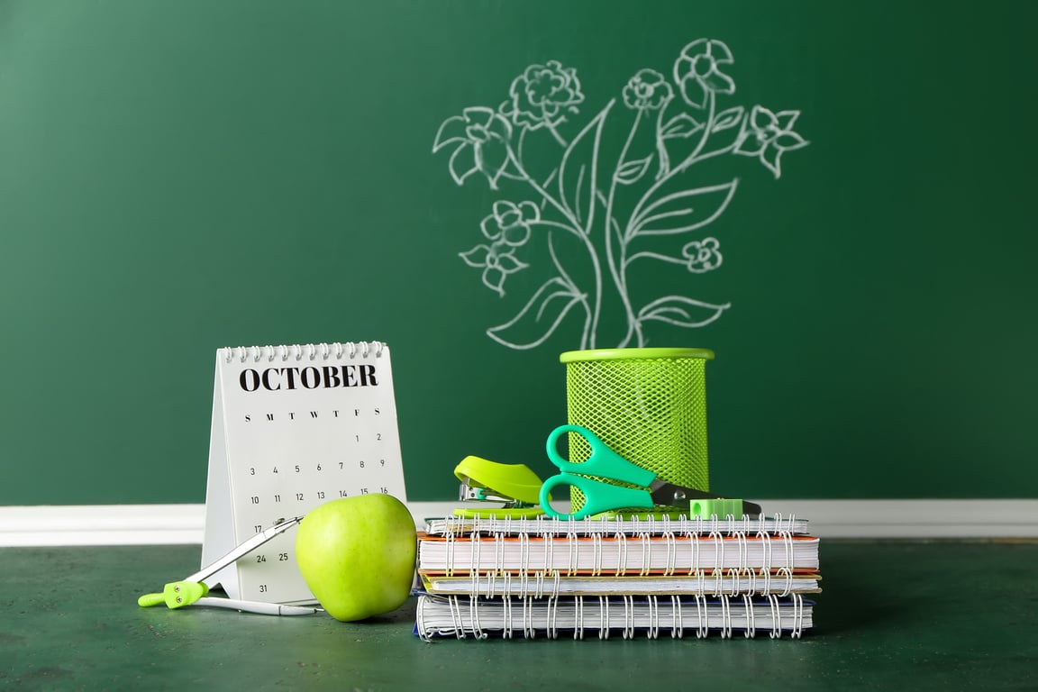 Flip Calendar with Apple and Stationery in Classroom